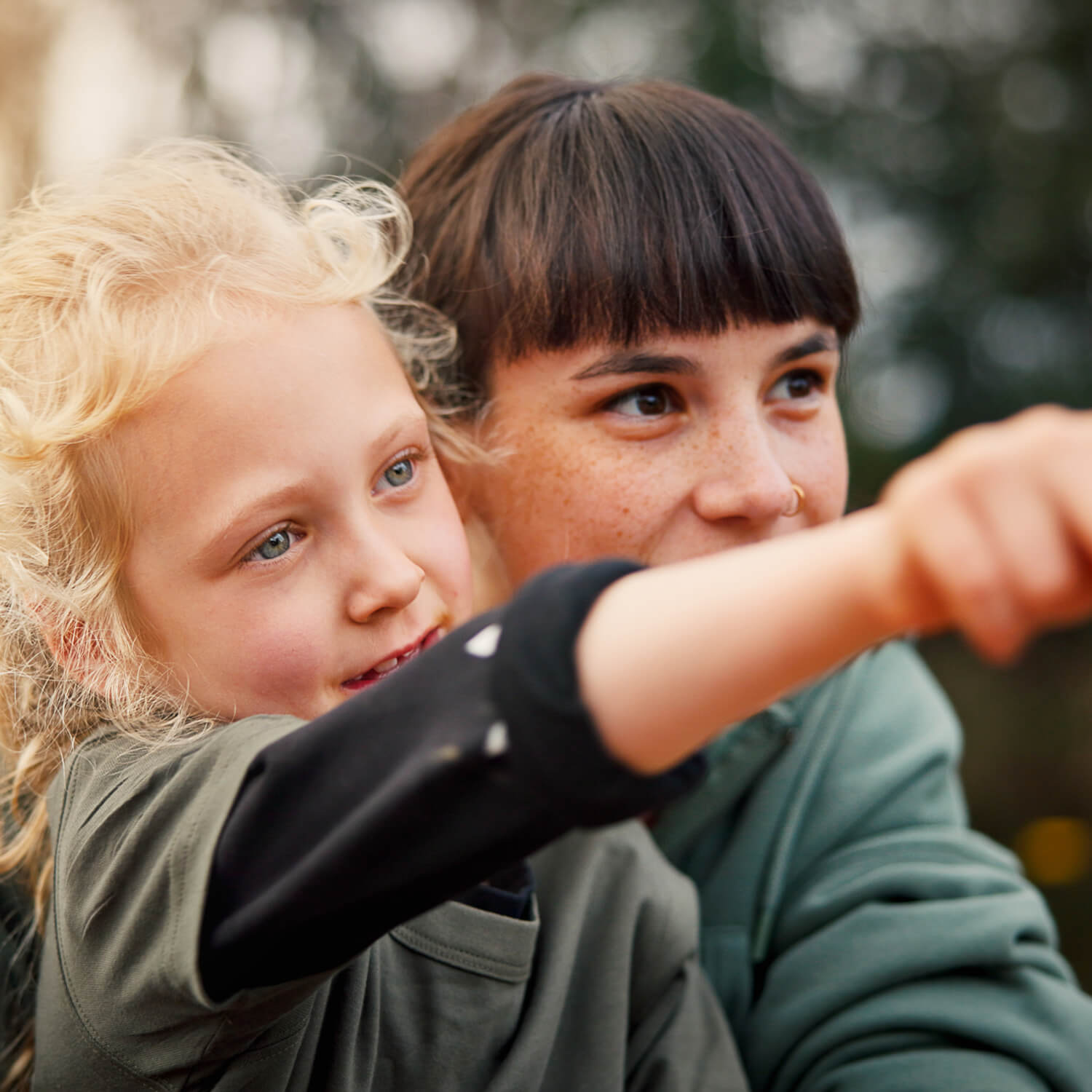 Two children pointing in playground