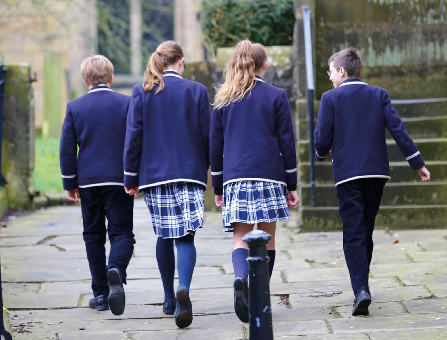 Children walking towards building